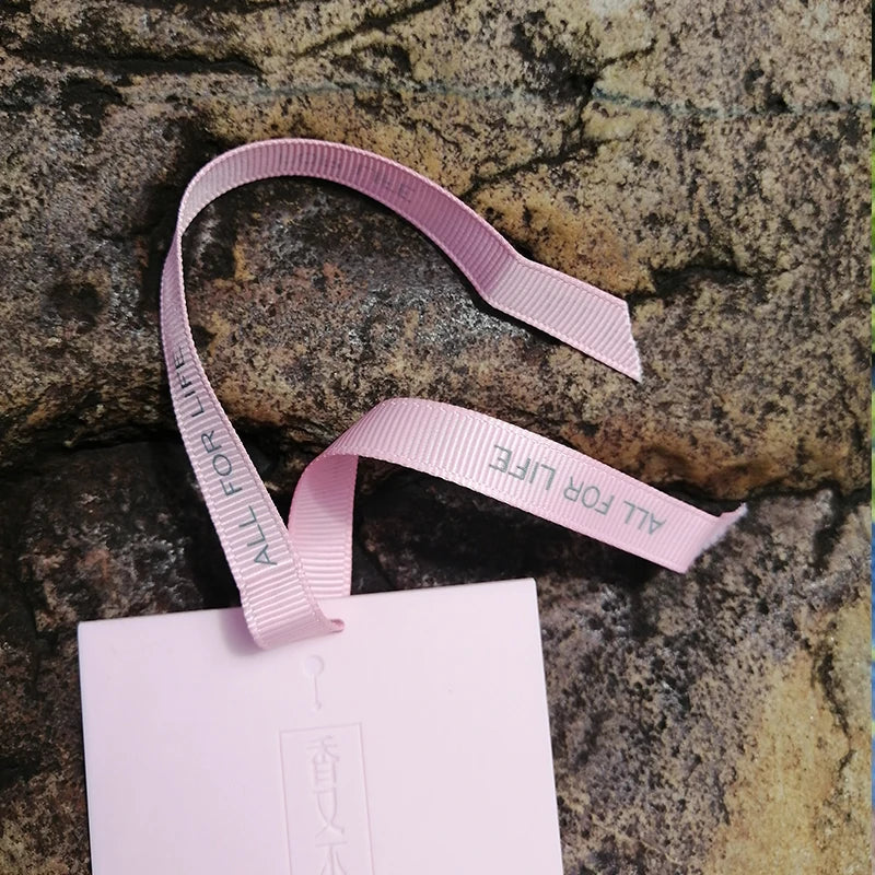 LOY Home Decor & Clothing Wear Aromeasy ceramic aromatherapy diffuser with ribbon, displaying a sleek white design for air freshening.