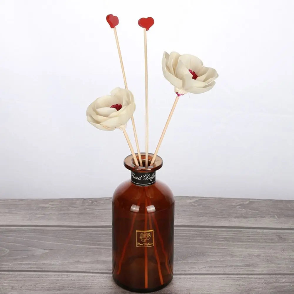 LOY Floral Aroma Oil Diffuser with decorative artificial flowers, home scent diffuser for relaxing aroma enhancement.